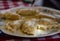 Healthy homemade dumplings lying on a white plate with knife and fork