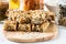 Healthy homemade granola bars and ingredients on background