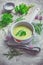 Healthy homemade green herb soup in pot made from local wild and garden herbs