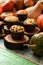 Healthy homemade sweets concept. Imperfect pumpkin muffins with seeds and chocolate on wood slabs on shabby green wooden