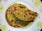 Healthy indian stuffed parothaaHealthy indian stuffed paratha in serving plate