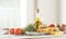 Healthy ingredients on a kitchen table - spaghetti, olive oil, t