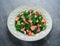 Healthy kale salad with strawberries and almond in a white plate