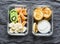 Healthy kids school, walk picnic lunch box - pancakes with sour cream and banana, kiwi, tangerine fruit. Delicious snack on a