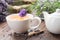 Healthy lavender herbal tea cup, tea kettle, fresh and dry lavender flowers on table