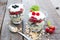 Healthy layered dessert with yogurt, black currant and raspberries