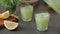 Healthy lemonade with ice and tarragon for detoxification is poured into glasses. Cold non-alcoholic summer drink. Cooling drink p