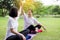 Healthy and lifestyle concept,Asian women raise up hands and relax at park in the morning together,Happy and smiling,Positive thin