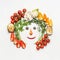 Healthy lifestyle concept. Funny face made with various vegetables ingredients on white background