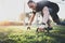 Healthy lifestyle concept.Young athlete exercising push up outside in sunny park. Fit shirtless male fitness model in