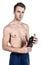 Healthy lifestyle and fitness. Handsome guy sports a physique, with a naked body, with a bottle of water in his hands, isolated on