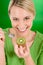 Healthy lifestyle - happy woman holding kiwi