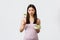 Healthy lifestyle, leisure and people emotions concept. Gloomy pouting asian girl dislike eating vegetables, holding