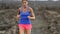 Healthy lifestyle runner woman trail running cross country running on volcano