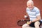 Healthy lifestyle, senior man, pensioner playing tennis on the court, sport concept