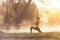 Healthy Lifestyle. Silhouette meditation yoga woman for relax vital and energy in the morning at the hot spring park.