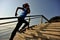 Healthy lifestyle sports woman running up on stone stairs sunrise