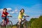 Healthy lifestyle - teenage girl and boy riding bicycles