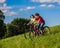 Healthy lifestyle - teenage girl and boy riding bicycles