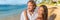 Healthy lifestyle vacation couple banner relaxing on beach honeymoon travel. Interracial young people in love at sunset