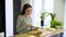 Healthy Lifestyle. Woman Cutting Fresh Fruits At Kitchen