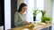 Healthy Lifestyle. Woman Cutting Fresh Fruits At Kitchen