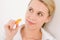 Healthy lifestyle - woman holding tangerine slice