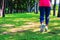 Healthy lifestyle woman runner jogging on beautiful summer day in the public green park. Fitness and workout wellness concept