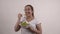 Healthy lifestyle young girl in white t-shirt eating a fresh salad smiling happy