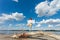 Healthy lifestyle young woman practice yoga on  dried trunk on the river beach fresh air sunny summer day