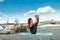 Healthy lifestyle young woman practice yoga at river beach at fresh air sunny summer day balance pose