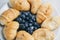 Healthy light breakfast. blueberries, croissants on a plate. close up, top view. proper nutrition for a slim figure. raw food