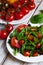 Healthy and light summer lunch: fresh green salad with ripe red tomatoes. Low calories delicious meal, vegan and vegetarian diet.