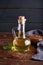 Healthy Linseed oil in glass bottle. Dark wooden background Copy space