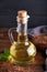 Healthy Linseed oil in glass bottle. Dark wooden background Copy space