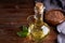 Healthy Linseed oil in glass bottle. Dark wooden background Copy space