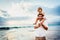 Healthy loving father and daughter playing together at the beach