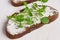 Healthy macrobiotic breakfast. Sandwich with cream cheese and peas microgreens