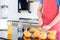 Healthy man is preparing orange and slicing to make juicing, orange juice in kitchen room at home