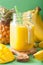 Healthy mango pineapple smoothie in mason jars