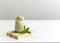 Healthy matcha dessert with aquafaba and mint. Glass jar on neutral background with copy space