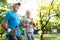 Healthy mature couple jogging in a park at early morning with sunrise