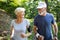 Healthy mature couple jogging in a park at early morning with sunrise