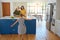 Healthy meals make for healthy children. a little girl dancing while her mother and grandmother cooks in the background.