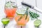 healthy morning fresh drink, knife, lime and rosemary on wooden table background