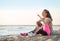 Healthy mother and baby girl on beach