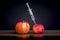 Healthy and mutilated apple. Introduction dose of drugs. Drug addiction. Injection during illness_