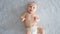 A healthy newborn baby in a nappy without clothes. Cute baby with blue eyes . Happy newborn boy lies on a blue blanket and