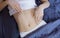 Healthy nutrition and belly health concept. Close up of woman flat stomach. Girl in bed with hungry feeling. Top view. Banner