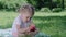 Healthy Nutrition. Child Eating Juicy Apple Outdoors